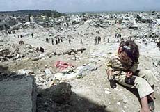 A Palestinian girl plays in the destroyed Jenin refugee camp