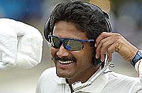 India's bowler Anil Kumble puts on a headset