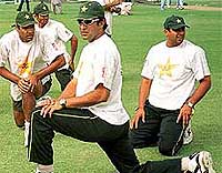 Wasim Akram, Waqar Younis, Inzamam-ul-Haq and Abdur Razzak of Pakistan stretches during a training session