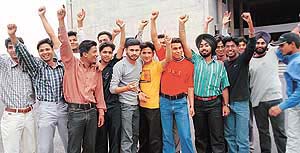 Students of Government College, Sector 46, raise slogans against Panjab University