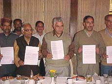 The Himachal Pradesh State BJP Chief, Mr Jai Kishen Sharma, Mp, Mr Suresh Bhardwaj and Minister, Mr Narendera Bragta, releasing the manifesto of the ruling BJP at Shimla 