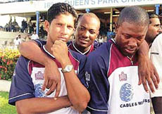 Brian Lara of the West Indies, center, consoles his teammates