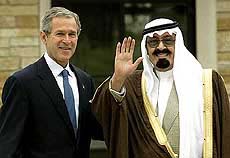President Bush poses with a waving Saudi Crown Prince Abdullah during the latter's arrival at the Bush ranch in Crawford, Texas, on Thursday.