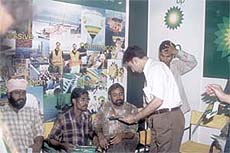 Mr Nilesh Koul, Brand Manager, bp, handing over 'bp passport' to truck drivers.