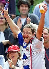 Gaston Gaudio of Argentina celebrates after beating Lleyton Hewitt of Australia