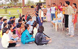 Students of Ajit Karam Singh International School, Sector 40, attend North Zone Cultural Centre�s children�s theatre workshop being organised at Kala Gram.