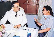 Dr Achintya Moulik, a Senior Consultant at Fortis Heart Institute, examines a patient at a free cardiac camp held at Nalagarh on Sunday.