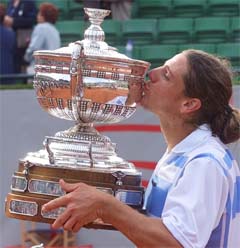 Gaston Gaudio of Argentina kisses the Barcelona Open Trophy 