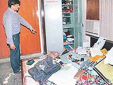 Mr Sandeep Sehgal, a resident of Sector 17, Panchkula, shows goods scattered in a room after a burglary at his house on Sunday.
