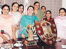 Ms Sunita Sharma (fourth from left), president of the local unit of the Indian Revenue Service (Customs and Central Excise) Ladies Association with the trophies awarded to the association for carrying out welfare projects in Chandigarh.