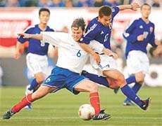 Slovakia�s Karol Kisel (L) fights for the ball