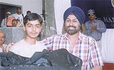 Mayank Sood being presented the Most Promising Player award after the final of the All-India Om Nath Sood Cricket Tournament