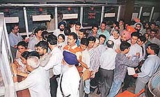 Telephone subscribers wait in long queues to deposit bills after their phones were disconnected by the BSNL for the alleged non-payment of bills.