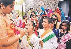 A teacher applies make-up on the face of a student at the annual function of Kendriya Vidyalaya, Sector 47, in Chandigarh on Thursday.