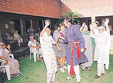 Bridging the gap between the old and the young: Students of Vivek High School dance with inmates of Old Age Home, Sector 15, Chandigarh, on Friday.