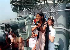 An American lady naval officer helps a destitute girl