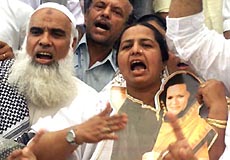 The activists of the Delhi Pradesh Youth Congress at a dharna demanding the removal of Mr Narender Modi as the Chief Minister of Gujarat in the Capital on Friday.