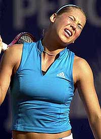 Russian tennis player Anna Kournikova reacts after losing the game