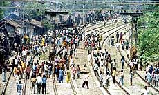 Shanty dwellers of Lake Gardens in Kolkata block railway tracks