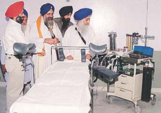 Jathedar Iqbal Singh of Takht Sri Patna Sahib (third from right) takes a round of the operating theatre after the inauguration of the gynaecology wing of Sri Harkrishan Sahib Eye Hospital, Sohana, on Sunday.