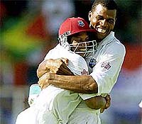 West Indies fast bowler Mervyn Dillon embraces team-mate Ramnaresh Sarwan