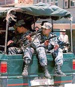 Police patrol the streets of Katmandu, Nepal to discourage activity of Maoist rebels Monday on Monday. 