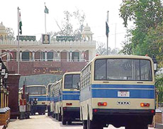 Buses cross the Wagah checkpost on their way to Afghanistan via Pakistan.