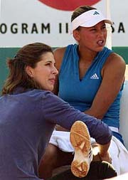 Russian tennis star Anna Kournikova receives a massage