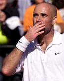 Andre Agassi of the US blows a kiss to spectators