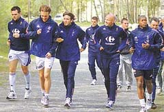 France soccer World Cup coach Roger Lemerre (R) seen with players