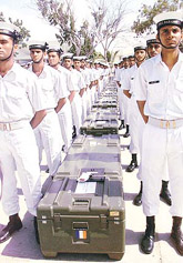 Pakistan Navy officers flank the coffins of 11 French Navy engineers during a ceremony in Karachi on Saturday. 