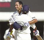 VVS Laxman (facing camera) is hugged by Ajay Ratra