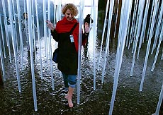 A visitor walks through a water park at the Expo.02 "arteplage" in Neuchatel