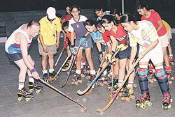 The visiting Italian roller hockey coach, Baraldi Aldo (extreme left), gives tips to probables at KB DAV Centenary School, Sector 7, Chandigarh, on Monday.