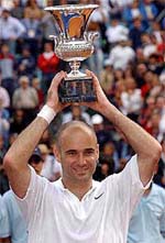 US tennis player Andre Agassi holds his trophy