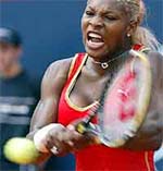 Serena Williams of the USA returns the ball