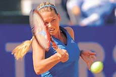 Russia's Anna Kournikova returns a forehand shot to Marta Marrero of Spain during their match at the Italian Open on Tuesday in Rome.