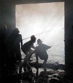 Fire fighter trying to douse the fire