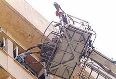 Firemen rescuing the trapped inmates 