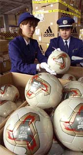 Customs officers check " Fevernova," official match balls