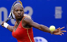 Serena Williams of the USA returns a backhand shot