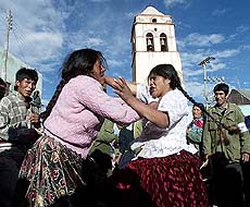 Aymara Indian women pommel each other in the ancient and bloody ritual fight known as "tinku"