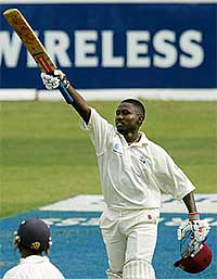 West Indies' batsman Wavell Hinds celebrates his century