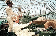 Pakistani soldiers man an anti-aircraft gun in Karachi