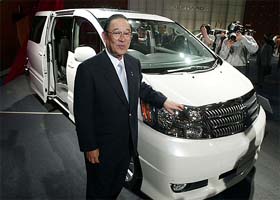 Toyota Motor Corp president Fujio Cho poses for photographs