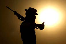 A soldier keeps a watch