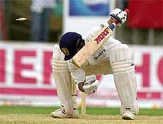 India's batsman Sachin Tendulkar is bowled by Pedro Collins