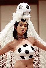 A Thai model wears a wedding dress
