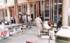 A litigant waits as District Bar Association advocates abstain from work