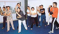 Amit Verma teaches dance steps to his students.